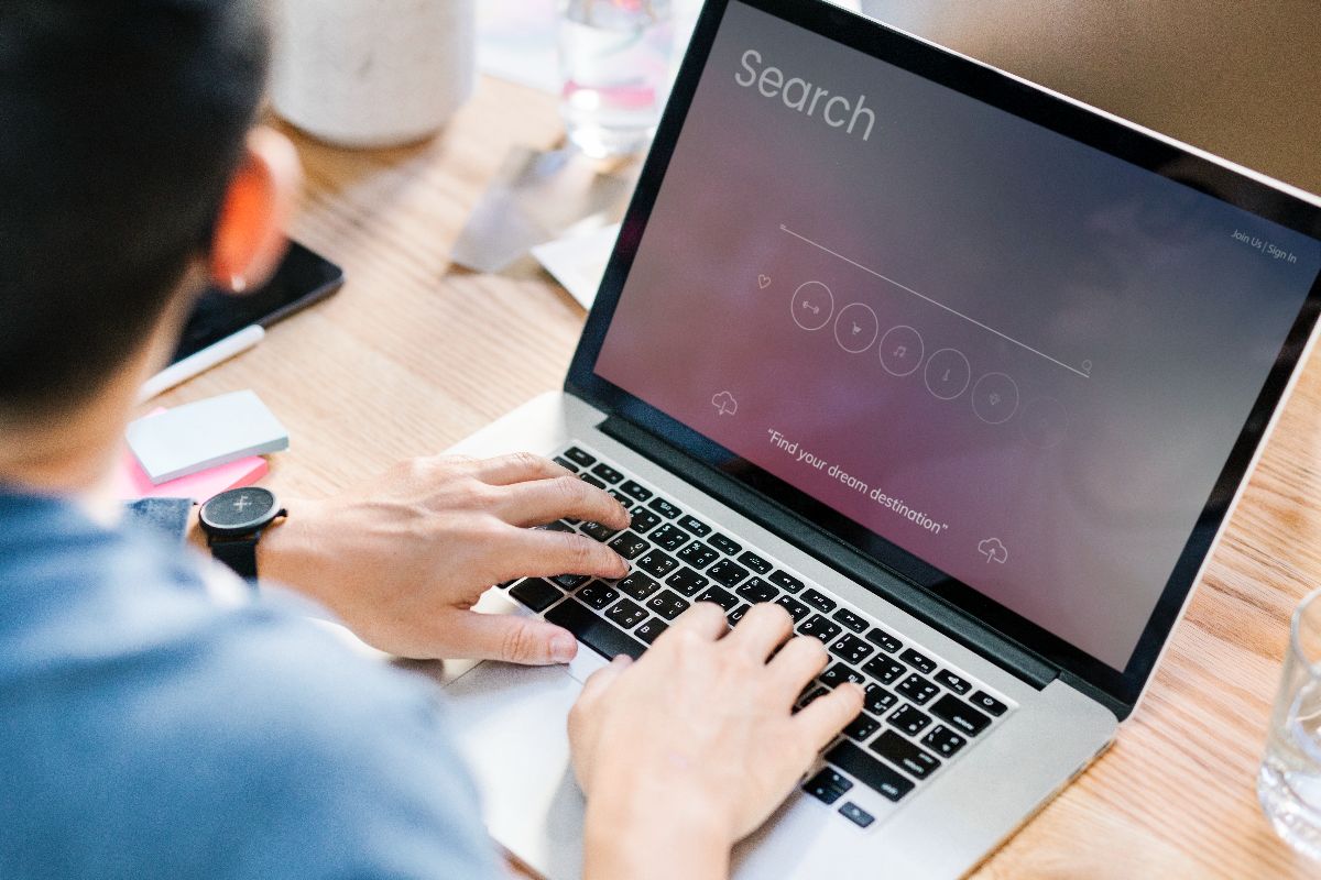 a person doing a search on his laptop