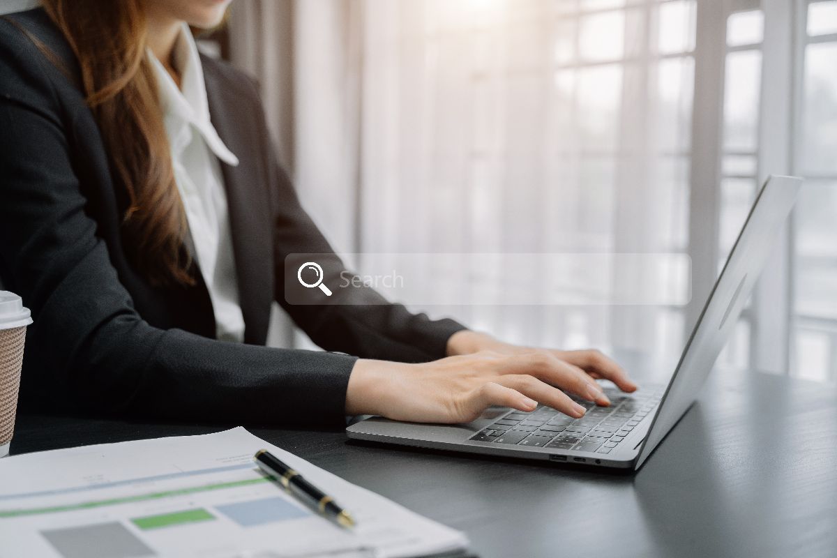 A woman optimizing a website's local AEO strategies