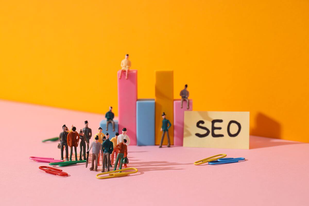 SEO concept showing people gathered around search ranking bars as search evolves beyond traditional results